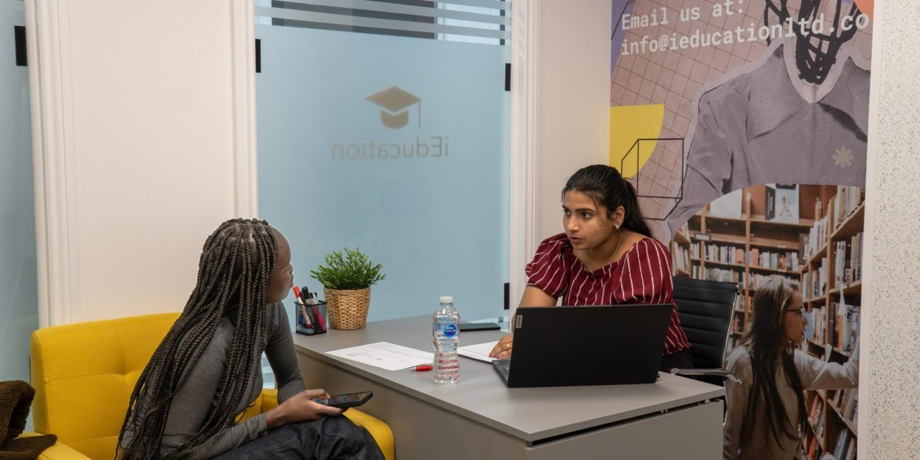 ieducation team member helping students